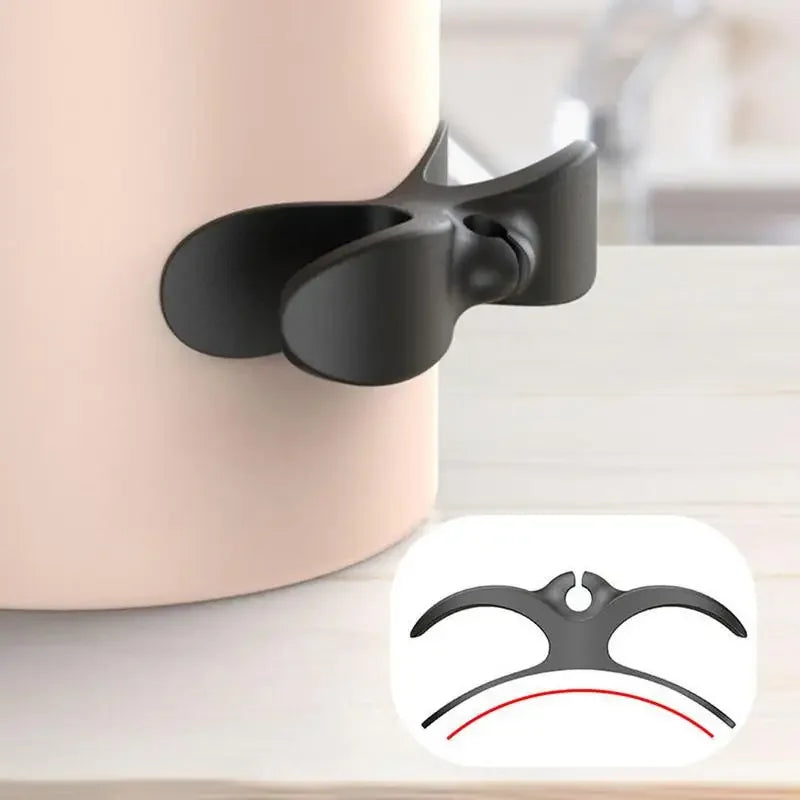 Cable winder stuck to the back of a kettle with the lead wrapped around it