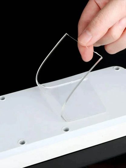 Double sided tape being peeled from a surface without marks