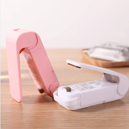 Mini heat sealer sealing a food bag