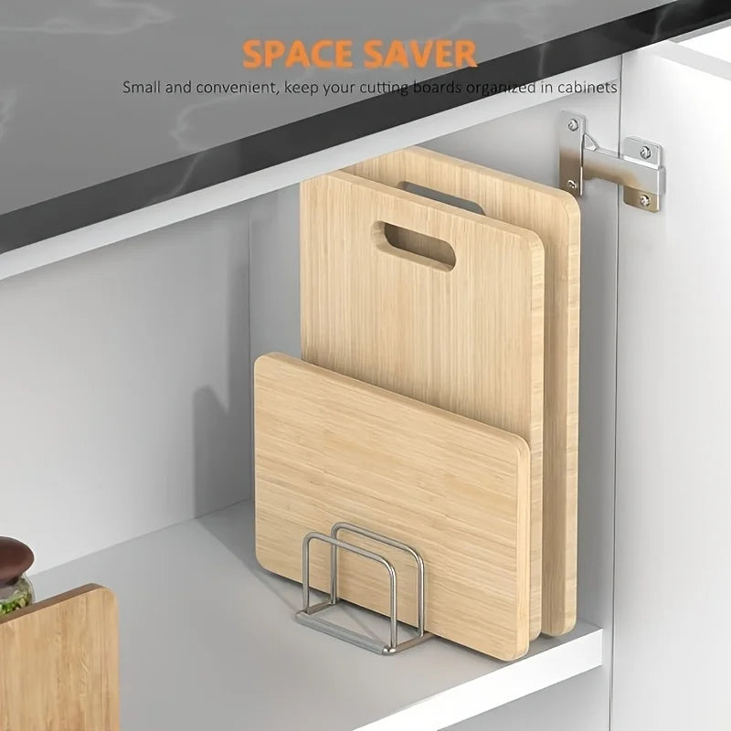 Stainless steel pot lid and chopping board rack on a kitchen worktop