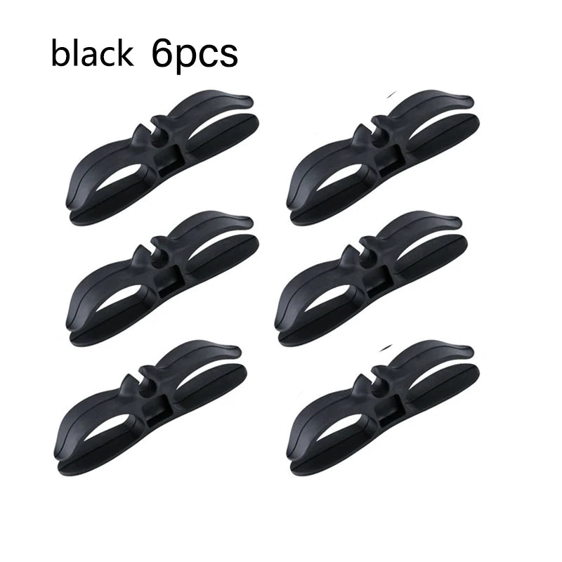 Six black adhesive cable winders for kitchen appliance leads