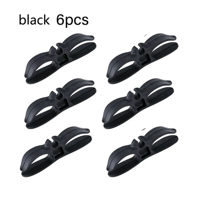 Six black adhesive cable winders for kitchen appliance leads