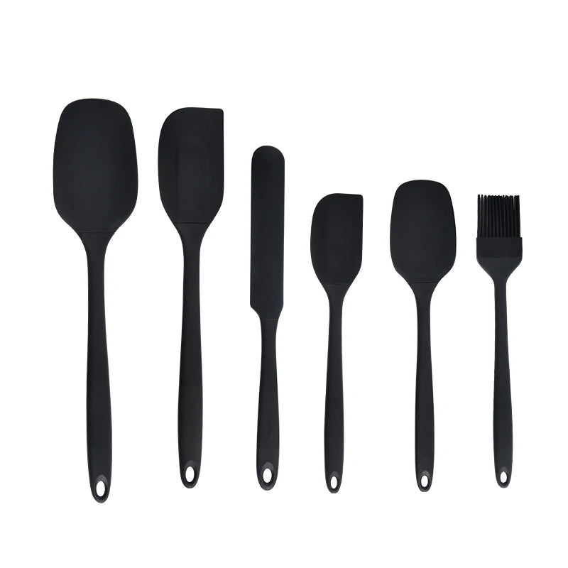 Black six-piece silicone baking utensil set with spatulas, scrapers and pastry brush