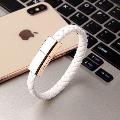 Charging bracelet unclipped to show the USB cable inside